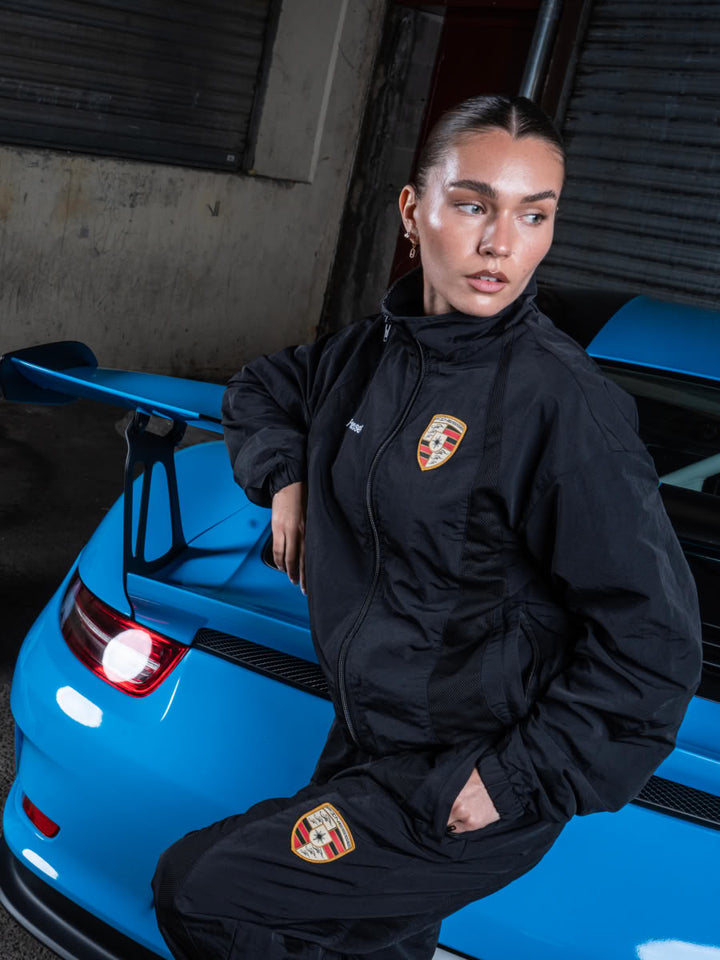 Model wearing the 911 Zip Jacket Black - Finesse lookbook