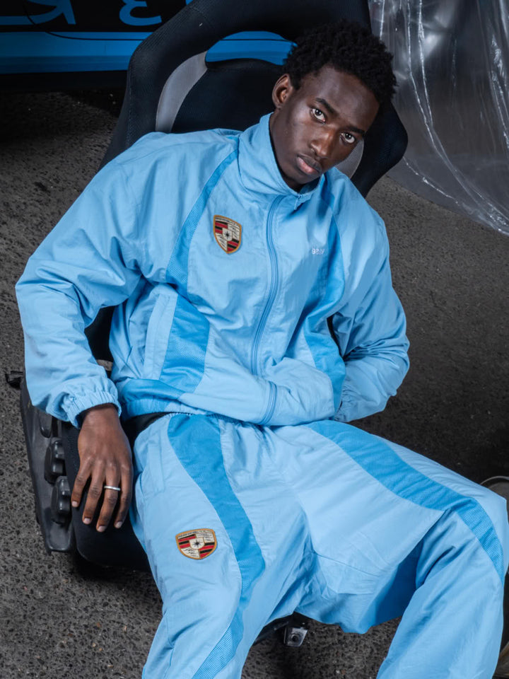 Model wearing the 911 Zip Jacket Blue - Finesse lookbook