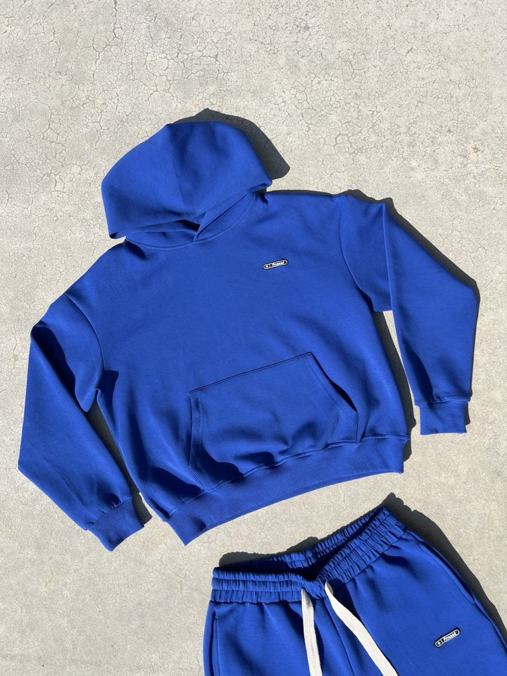 Finesse Air Cotton Hoodie bleu présenté à plat en packshot