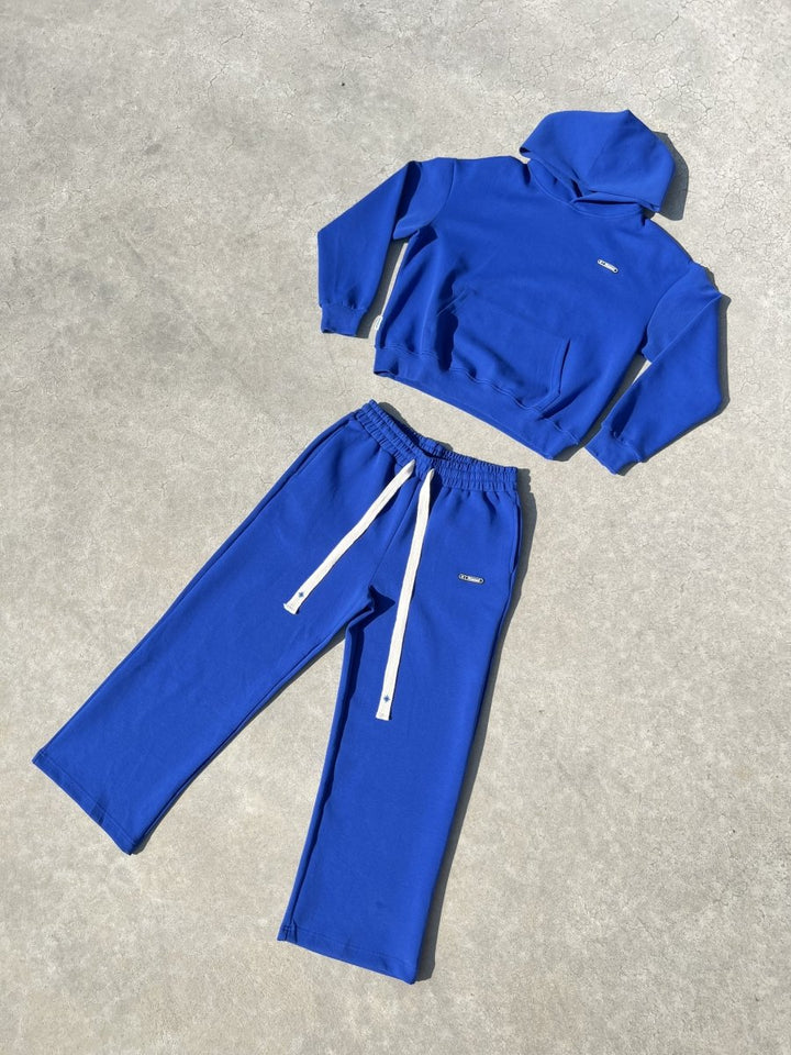 Ensemble complet Finesse Air Cotton bleu présenté à plat.