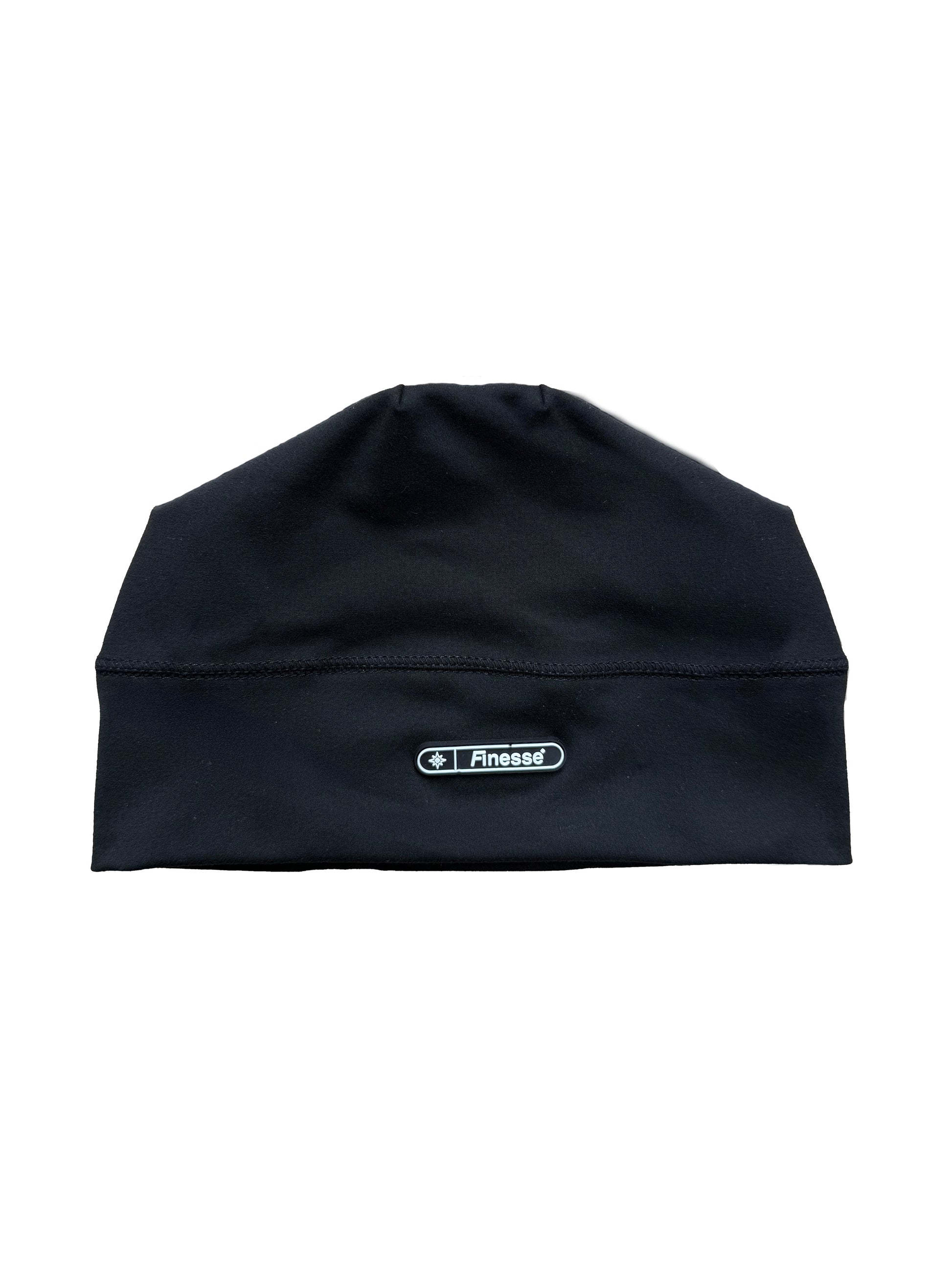 Bonnet Finesse Skull Cap Beanie posé sur fond blanc.