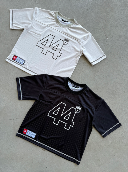 Jersey 44 black et 44 white superposés au sol en packshot.