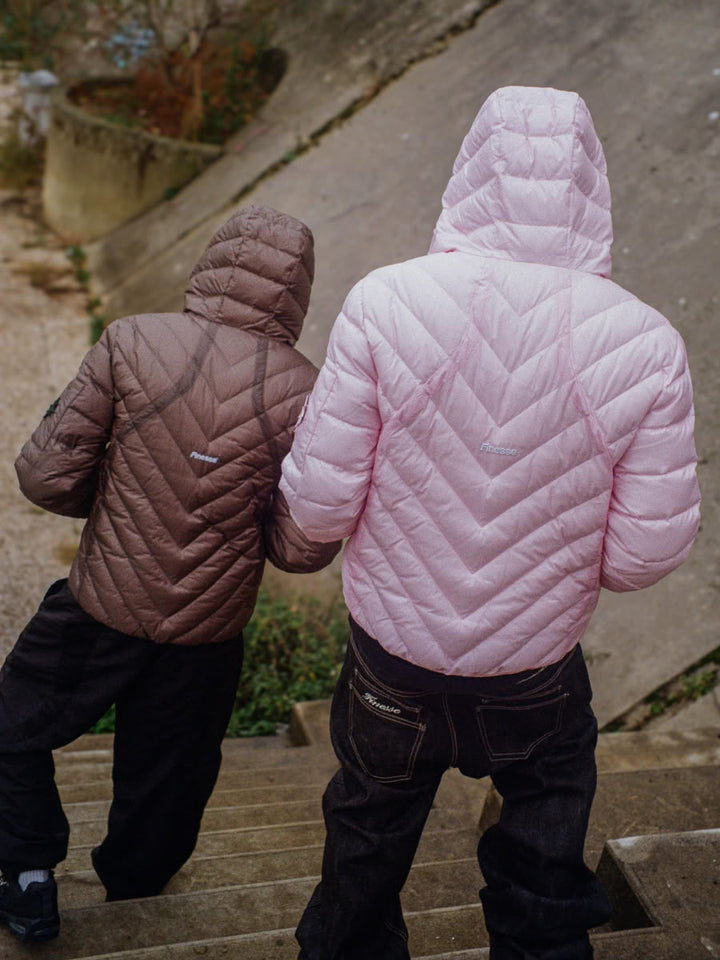 Models wearing the Slim Puffer Jacket in dark grey and pink - Finesse lookbook